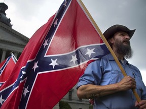 Pro-confederate flag demonstrator Jim Horky stands outside the South Carolina State House in Columbia, South Carolina, June 27, 2015. AFP PHOTO/JIM WATSON
