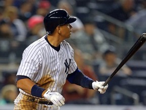 New York Yankees designated hitter Alex Rodriguez (13) watches his two-run home run against the Detroit Tigers during the third inning at Yankee Stadium. (Adam Hunger-USA TODAY Sports)