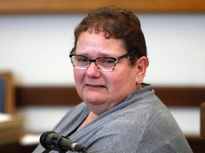 In this June 25, 2015 file photo, Dominique Cottrez, 51, appears in the courtroom of Douai, northern France,  accused of multiple counts of first-degree murder of minors. The woman accused of killing eight of her newborns over more than a decade is awaiting a verdict after a dramatic and teary murder trial. (AP Photo/Michel Spingler, File)
