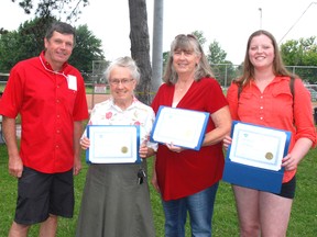 Dutton/Dunwich Mayor Cameron McWilliam congratulates citizens who were honoured at Canada  Ceremonies.. Second from left, Margaret Hulls, winner of the Dan Moore Volunteer award, Lynda Drummelsmith, winner of the Mark Van Brenk Memorial Award and Calli Barnes, youth volunteer award winner.