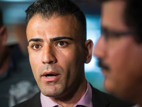 Sam Moini, owner of a  fleet garage HPM Taxi, addresses the media during a presser held by the Toronto Taxi Association at City Hall on July 2, 2015. (Ernest Doroszuk/Toronto Sun)