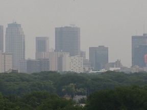 The skyline of Winnipeg, Man. is partially obscured by smoke from distant forest fires Thursday, July 2, 2015.