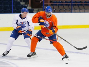 Connor McDavid, left, and Darnell Nurse, shown here running a drill during Oilers orientation camp Thursday at Rexall Place. (Perry Nelson, Edmonton Sun)