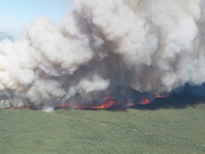 A view of the Mount Bigfoot wildfire in northeastern British Columbia is shown in a June 28, 2015 handout photo. THE CANADIAN PRESS/HO-BC Wildfire Service
