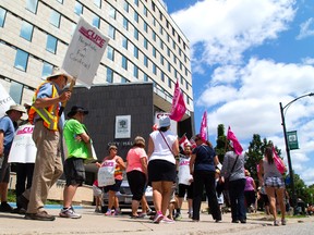 Striking city inside workers, members of CUPE Local 101, walk the picket line at London city hall as union and city negotiators returned to the bargaining table Thursday, Day 39 of the municipal strike. (MIKE HENSEN, The London Free Press)