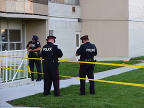 Toronto Police outside an apartment building at 1130 Wilson Ave. where a child fell from an eighth-floor window on July 2, 2015. (Victor Biro/Special to the Toronto Sun)