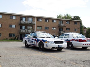 London Police cruisers are parked outside of 1825 Whitney Street, where Suzan Aisha Jacob, 50, was stabbed to death early Wednesday morning, as they continue their investigation at the east end apartment building in London, Ont. on Thursday July 2, 2015. (CRAIG GLOVER, The London Free Press)