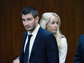 Kings defenceman Slava Voynov enters Superior Court with his wife, Marta Varlamova, in Torrance, Calif., on Thursday July 2, 2015. (Brad Graverson/The Daily Breeze via AP)