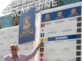 Trainer Reade Baker — seen here standing in front of the post positions for this Sunday’s Queen’s Plate — is looking for his first Plate victory in nearly 40 years in horse racing. (MICHAEL BURNS/Photo)