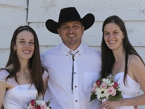 Self-styled Montana polygamist Nathan Collier poses with his wives Christine, right, and Vicki in this undated handout photo courtesy of Collier. Collier, who was featured on the reality television show "Sister Wives", said on July 2, 2015, he will sue the state if it denies him the right to legally wed his second wife. (REUTERS/Nathan Collier/Handout via Reuters)