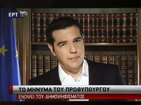 Greek Prime Minister Alexis Tsipras is seen on a television monitor while addressing the nation in Athens, Greece July 3, 2015. Greek Prime Minister Alexis Tsipras on Friday said an IMF analysis showing Greece's debt is unsustainable justifies his government's decision to reject an aid package from creditors that offered no debt relief. REUTERS/ERT/Pool