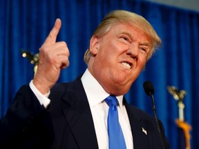 Republican presidential candidate Donald Trump gestures and declares "You're fired!" at a campaign rally in Manchester, New Hampshire, in this file photo taken June 17, 2015. New York City is reviewing its contracts with Donald Trump following comments by the developer and U.S. presidential candidate insulting Mexicans, Mayor Bill de Blasio said on Wednesday.  REUTERS/Dominick Reuter/Files