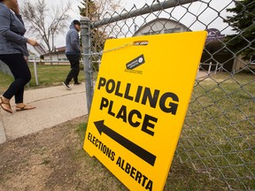 People enter a polling station at Meadowlark Christian School in the Edmonton-Meadowlark riding in Edmonton, Alta, on Tuesday May 5, 2015 during Alberta's 2015 provincial election. Ian Kucerak/Edmonton Sun/Postmedia Network