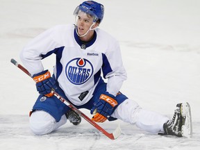 Connor McDavid stretches at the new player orientation, July 3, 2015 at Edmonton's Rexall Place.  (EDMONTON SUN PHOTO)