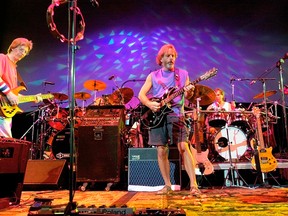 In this Aug. 3, 2002 file photo, The Grateful Dead, from left, Phil Lesh, Bill Kreutzmann, Bob Weir and Mickey Hart perform during a reunion concert in East Troy, Wis. The group  will perform three shows from July 3-5 at Soldier Field in Chicago. (AP Photo/Morry Gash, File)