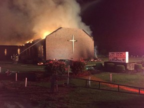 Fire crews try to control a blaze at the Mt. Zion African Methodist Episcopal Church in Greeleyville, South Carolina in this June 30, 2015 handout photo. The African-American church, which was burned down by the Ku Klux Klan 20 years ago, was the scene of another blaze on Tuesday, officials said, though the cause was not immediately clear. The fire comes amid a rash of fires that have erupted at black churches across the U.S. south, at least two of which have already been declared as deliberate. REUTERS/Clarendon County Fire Department/Handout via Reuters