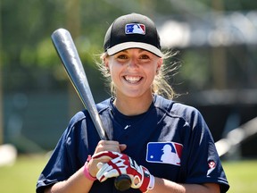 French teen Melissa Mayeux smiles as she poses at a baseball camp in Paderborn, Germany, Wednesday, July 1, 2015. (AP Photo/Martin Meissner)