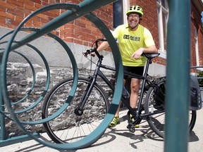 LUKE HENDRY/THE INTELLIGENCER
Coun. Egerton Boyce stands behind a bike rack at city hall in Belleville. He said his month commuting solely by bicycle taught him residents support a wider network of bike routes but the city's infrastructure has to catch up.
