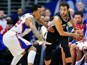 San Antonio Spurs guard Marco Belinelli (right) controls the ball against Los Angeles Clippers forward Matt Barnes during NBA play at Staples Center. (Gary A. Vasquez/USA TODAY Sports)