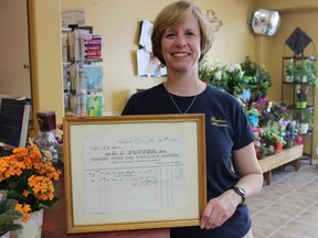 Samantha Reed/The Intelligencer
Anne McKinnon stands in her local business Barber's Flowers Friday afternoon. McKinnon’s business, Barber’s Flowers, is the oldest local flower shop in the area and will celebrate its 125 anniversary this month.