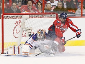 Edmonton Oilers goalie Viktor Fasth makes a save on Washington Capitals winger Joel Ward during NHL play at Verizon Center. (Geoff Burke/USA TODAY Sports)