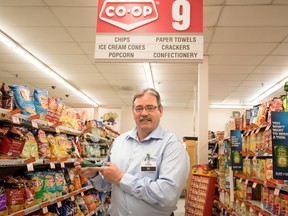 Ed Berney, general manager for the CO-OP in Stony Plain, holds his Integrity Award from the Rotary Club on Thursday, June 25, 2015. Berney has spent a lifetime volunteering in Stony Plain, including making Christmas hampers for families in need, coaching community soccer, and volunteering as a firefighter. Yasmin Mayne, Reporter/Examiner