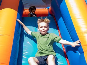 Marley McDonald slides down an inflatable structure on the last day of Keephills School on Friday, June 26. Keephills School will be closed permanently after this year, as there are not enough students to make it viable for Parkland School Division to keep it open. Yasmin Mayne, Reporter/Examiner