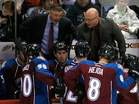 DENVER, CO - APRIL 07: (L-R) Head coach Patrick Roy and assistant coach Andre Tourigny of the Colorado Avalanche direct the team during a time out against the Nashville Predators at Pepsi Center on April 7, 2015 in Denver, Colorado. The Avalanche defeated the Predators 3-2.   Doug Pensinger/Getty Images/AFP== FOR NEWSPAPERS, INTERNET, TELCOS & TELEVISION USE ONLY ==