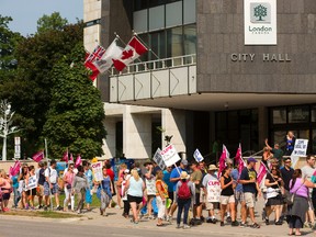 City hall inside workers walk the picket line Friday at city hall in London. (MIKE HENSEN, The London Free Press)