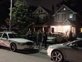Toronto Police arrive late on July 3, 2015 to investigate a suspicious death on Elmer Ave., near Queen St. E. and Woodbine Ave. (John Hanley/Toronto Sun)