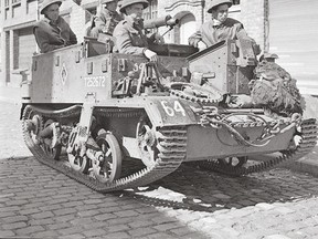 Infantrymen of the Toronto Scottish Regiment in their Universal Carrier waiting to move forward to the front lines on September 9, 1944, in Nieuport, Belgium