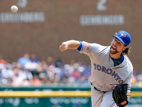 Blue Jays' R.A. Dickey pitches against the Tigers during first inning action in Detroit on Saturday, July 4, 2015. (AP Photo/Duane Burleson)
