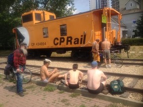 Bike riders at End of Steel Park in Edmonton prepare to strip and take part in Naked Bike Day July4, 2015, an event aimed at protesting body-shaming while pushing for reductions in car-dependency. TOM BRAID/EDMONTON SUN