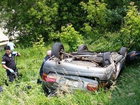 A car plunged over a guardrail and landed several metres below Black Creek Dr. on July 4, 2015. A man inside the car was killed and three others were injured. (Photo courtesy Frank Graziano)
