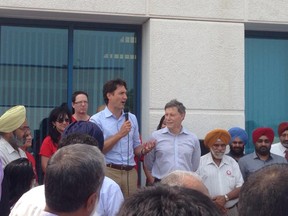 Liberal Leader Justin Trudeau addresses a crowd at the office of Winnipeg South candidate Terry Duguid Saturday, July 4, 2015.