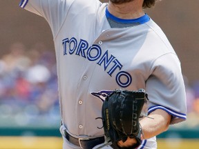 Blue Jays' R.A. Dickey pitches against the Tigers during first inning MLB action in Detroit on Saturday, July 4, 2015. (AP Photo/Duane Burleson)