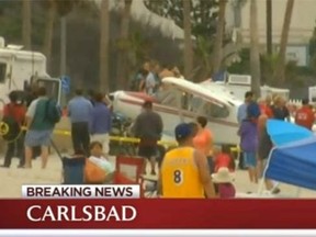 A small plane came falling from the sky crashed on a crowded beach in Southern California. (nbcsandiego.com screengrab)