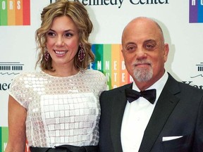 In this Dec. 7, 2013 file photo, Kennedy Center Honoree Billy Joel, right, and Alexis Roderick arrive at the Kennedy Center Honors gala dinner in Washington.  (AP Photo/Kevin Wolf, File)