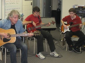 Jean-Guy (Chuck) Labelle helps students from Champlain on the Rock dans l'ame (Rock and Soul) project.