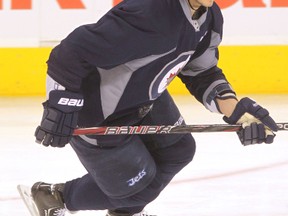 Winnipeg Jets #8 Alex Burmistrov skates during team practice at the MTS Centre in 2013.
