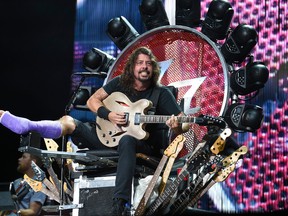 The Foo Fighters' Dave Grohl performs at RFK Stadium on Saturday, July 4, 2015, in Washington. (Photo by Nick Wass/Invision/AP)