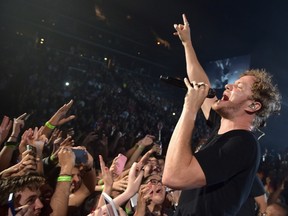 Dan Reynolds of Imagine Dragons performs at Barclays Center in Brooklyn, N.Y. on June 30, 2015. (Theo Wargo/Getty Images/AFP)