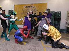 Some of the cosplayers from a Heroes for Harvest video join Taryn Brenner and Chris MacDonald of Abraxas Studios at the Winnipeg Harvest building. (Kevin King/Winnipeg Sun)