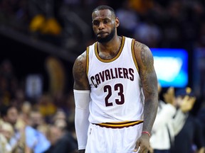 Cleveland Cavaliers forward LeBron James walks off the court after losing to the Golden State Warriors in Game 6 of the NBA Finals at Quicken Loans Arena on June 16, 2015. (Bob Donnan/USA TODAY Sports)