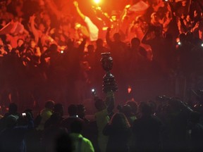 Chile's goalkeeper Claudio Bravo celebrates with the trophy of the 2015 Copa America football championship, in Santiago, Chile, on July 4, 2015. (AFP PHOTO/RODRIGO ARANGUA)