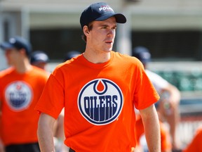 Oilers prospect Connor McDavid plays during a charity softball game between members of the Edmonton Police Service and the Edmonton Oilers Prospects at Telus Field in Edmonton, Alta., on Sunday July 5, 2015. The event benefits Constable Woodall Family Fund. Ian Kucerak/Edmonton Sun/Postmedia Network