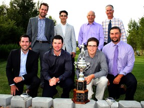 Team Timberwolf members (front row) Ryan Willoughby, Brian McGarry, Jordie Walker, Jesse Graham, (back row) Chase Woitowich, Nick Quesnel, John Hastie and Tom Clark pose with the Sudbury Ryder Cup after clinching their third title in four years on their home course Sunday. Ben Leeson/The Sudbury Star/QMI Agency