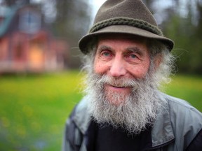 Burt Shavitz poses for a photo on his property in Parkman, Maine. Shavitz, a former beekeeper, is the Burt behind Burt's Bees. A spokeswoman for Burt’s Bees said Shavtiz died Sunday, July 5, 2015, at his home in rural Maine. He was 80. (AP Photo/Robert F. Bukaty, File)