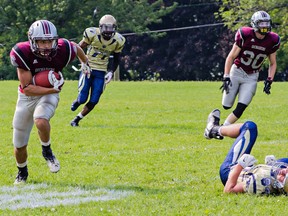Damon Fair runs 68 yards for a touchdown for the Limestone District Grenadiers in the first half against the Metro Toronto Wildcats in Ontario Varsity Football League varsity division play at Loyalist Collegiate and Vocational Institute on Saturday. (Kendra Pierroz/For The Whig-Standard)