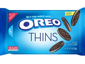 This product image provided by Mondelez shows the packaging design for "Oreo Thins." Mondelez International Inc. says it will add "Oreo Thins," which have a similar cookie-to-filling ratio as regular Oreos, except that they're slimmer, to its permanent lineup in the U.S. starting next week. (Mondelez via AP)